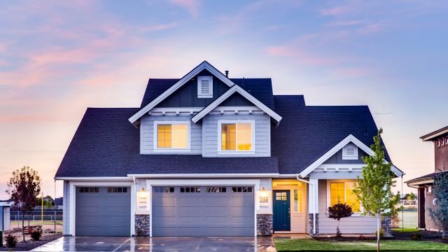 Detached house illuminated at dusk